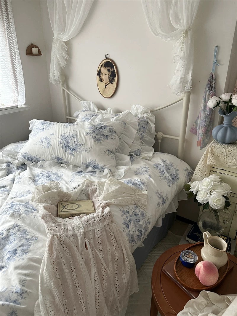 Blue floral lace ruffle cotton bedding set styled in a vintage French country bedroom