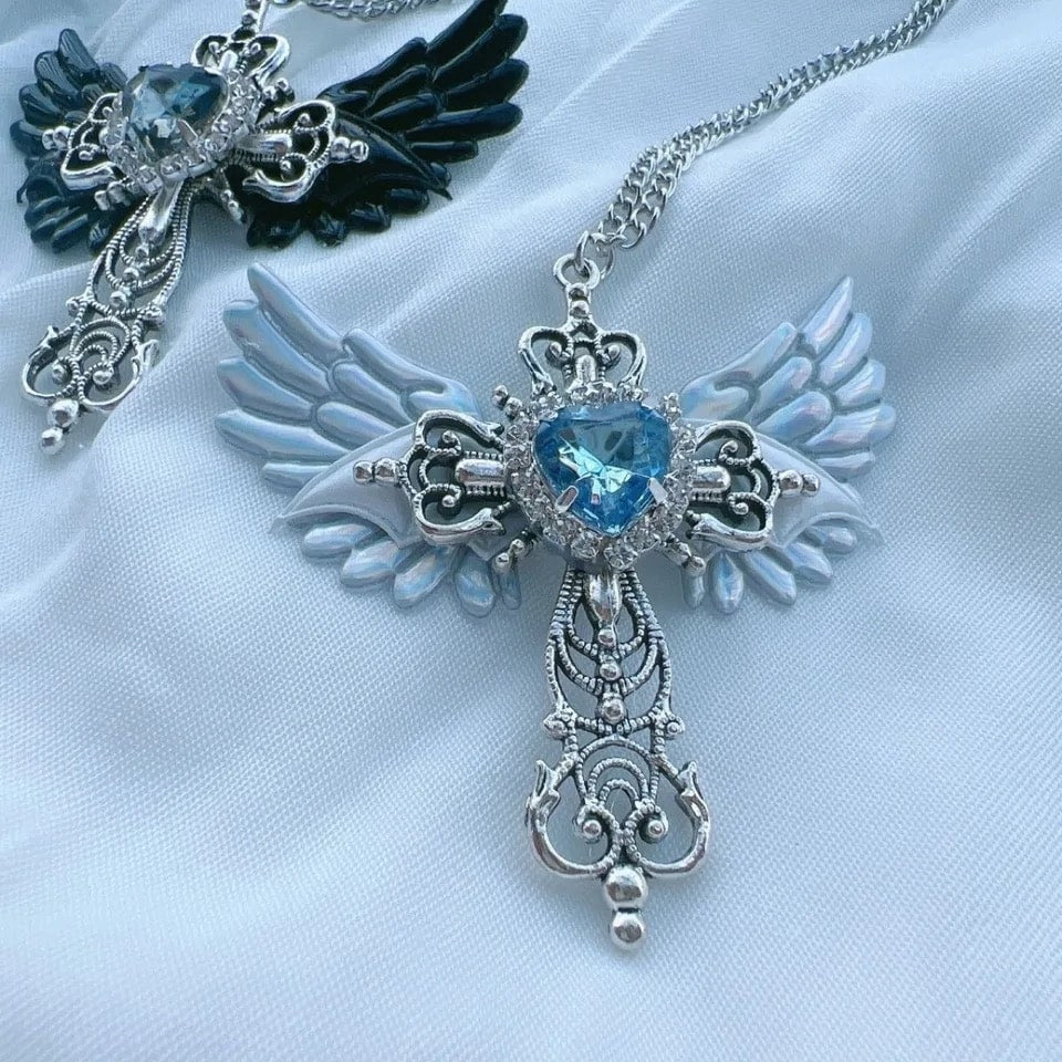 Gothic pendant necklace with blue heart and angel wings. Trendy Y2K cross charm necklace for women’s party and casual wear.