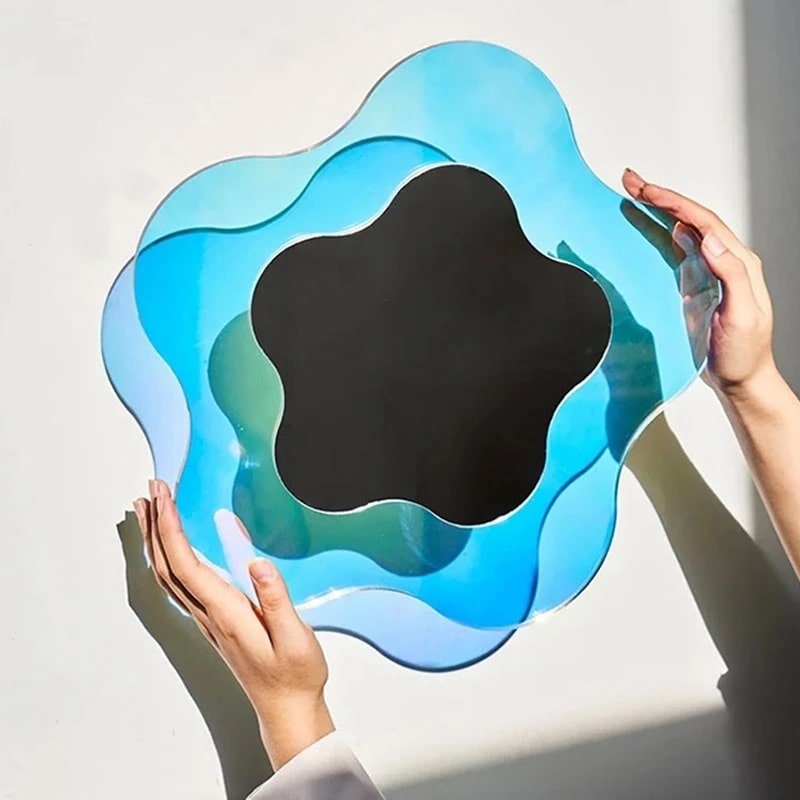 ridescent blue mirror with asymmetrical wave design