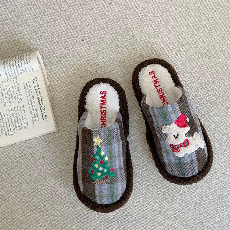 Blue plaid Christmas slippers with Christmas tree and puppy motifs on the floor
