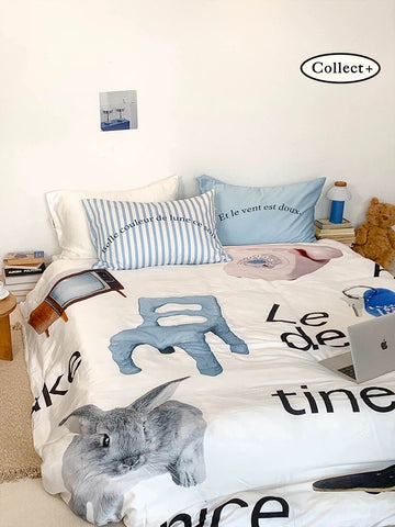 Blue rabbit duvet cover with oversized rabbit artwork and graphic lettering