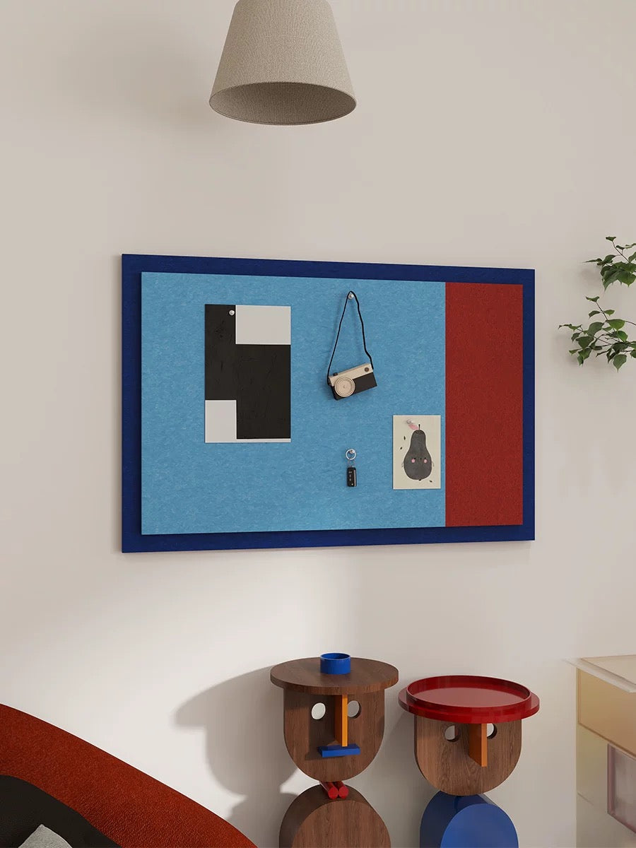 Blue and red felt bulletin board with geometric color block design