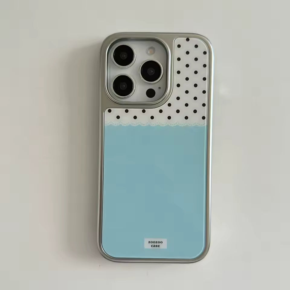 Phone case with polka dot design and gradient color on a light gray background