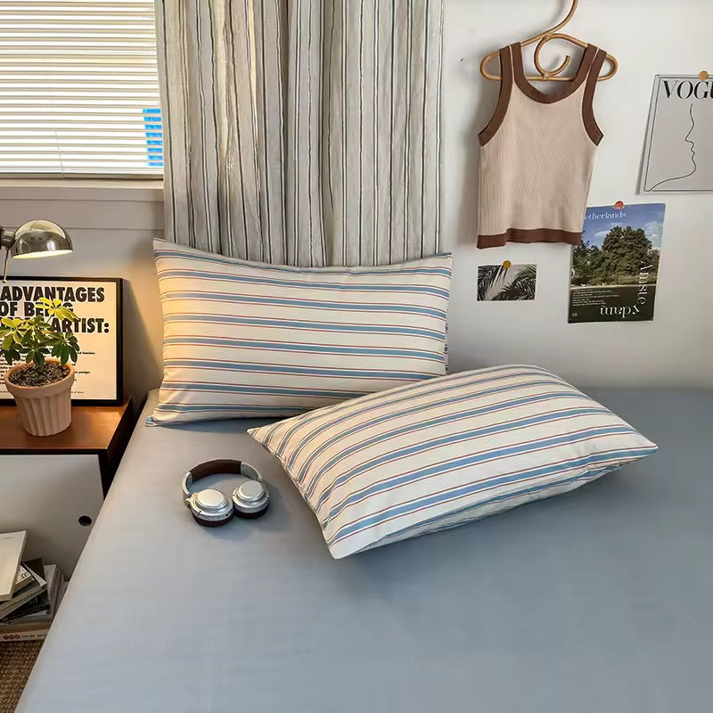 Blue striped cotton duvet set on cozy minimalist bed