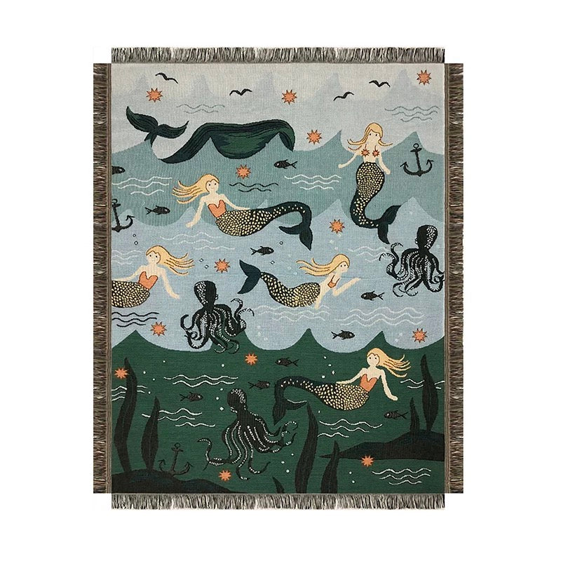 Mermaid-themed blanket with mermaids, octopuses, and sea creatures on a blue and green background.