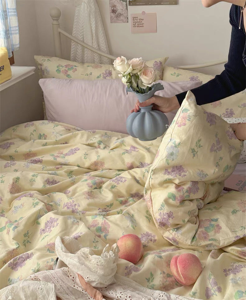 Butter yellow floral bedding set creating warm English cottage inspired sleep space with timeless botanical elegance