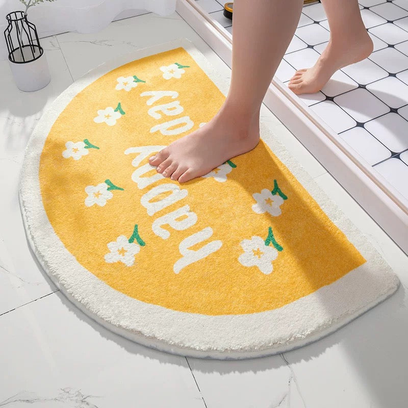 Soft cartoon bathroom mat with floral design on tile floor