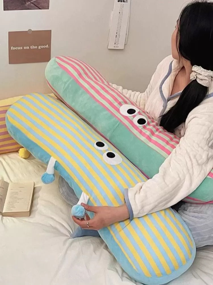 Long pillow with cartoon eyes for side sleeper support