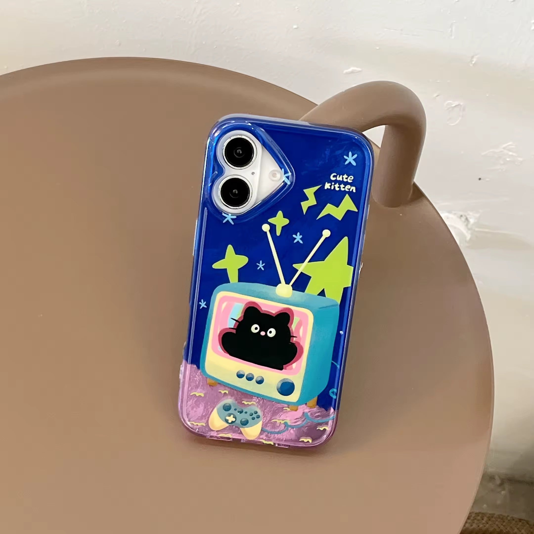 Cartoon kitty phone case with green stars and a game controller at the bottom