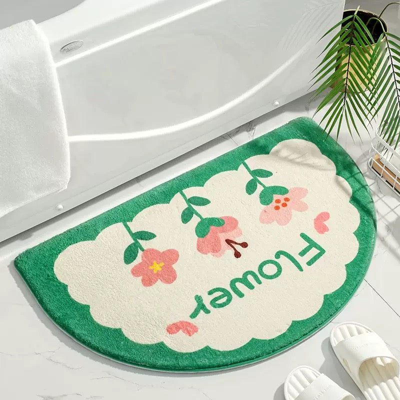 Soft bathroom mat with non-slip grip and half-round shape