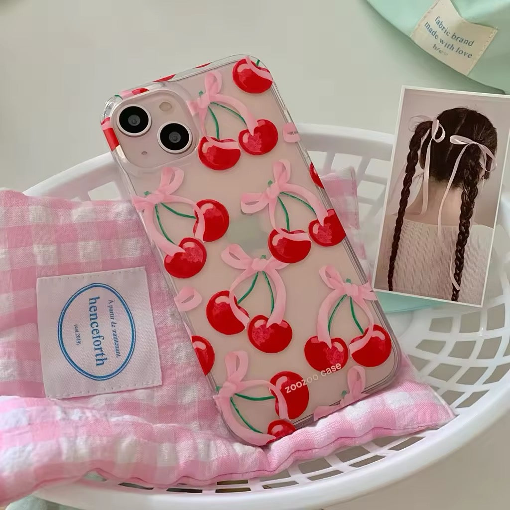 Clear iPhone case with cherry bow design, perfect for a girly aesthetic look