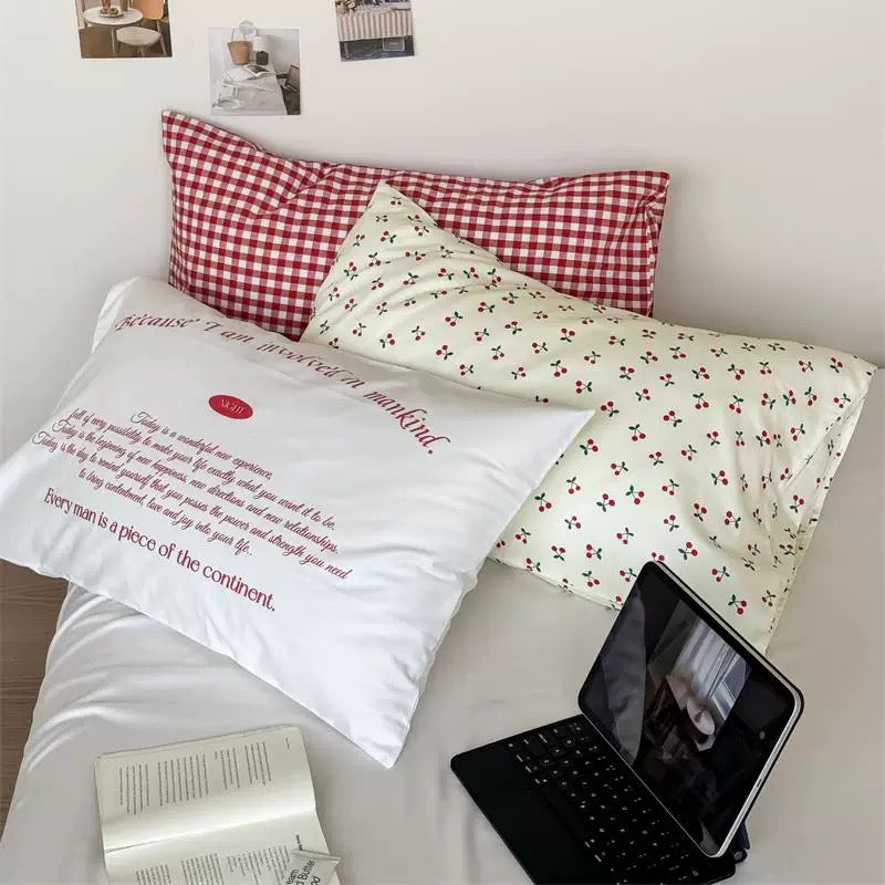 Aesthetic cherry cotton pillowcase styled in a soft girl bedroom with pastel decor.