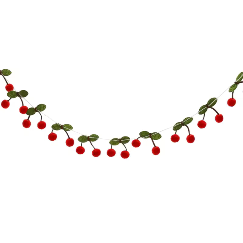 Decorative string with red berries and green leaves on a white background