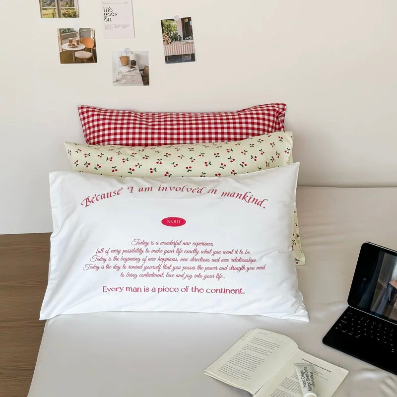 Cottagecore bedroom decorated with cherry cotton pillowcase and wicker basket.