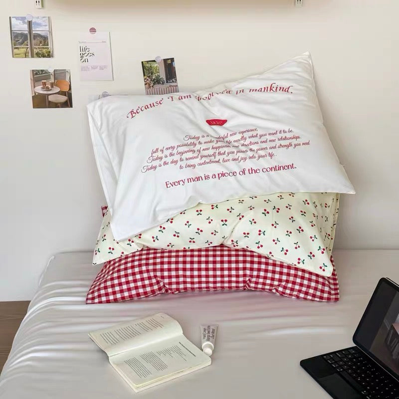 Kawaii pastel room decor showing cherry cotton pillowcase and cute plushies.