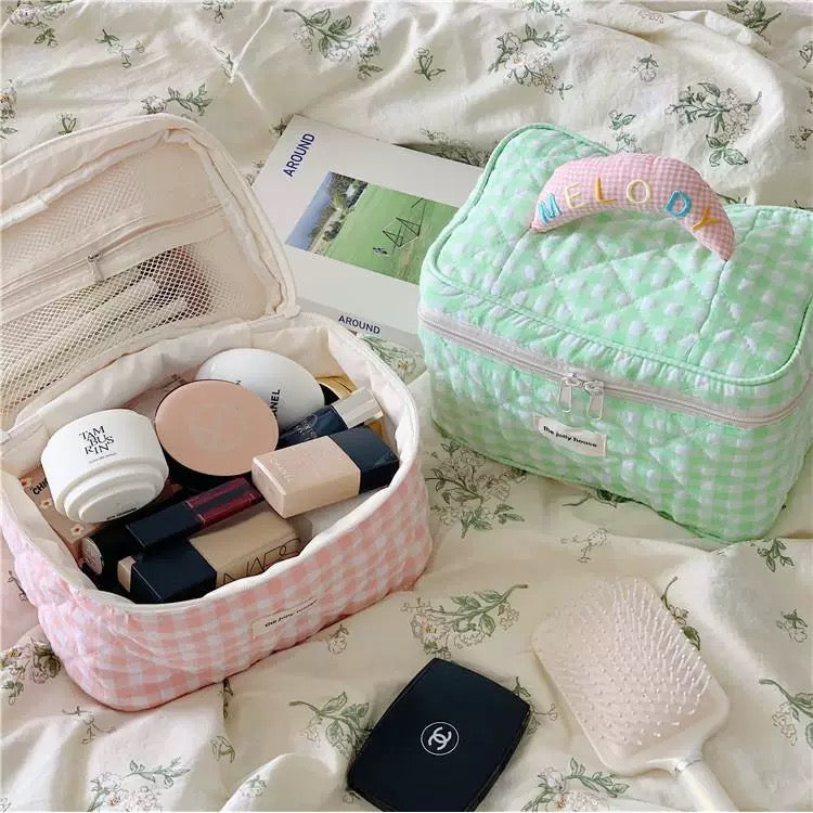 Chic plaid cosmetic bag with large capacity and pastel design, perfect for travel