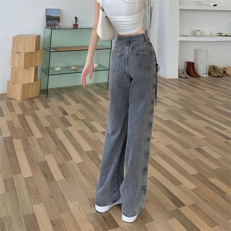 Loose fit wide-leg smoke gray denim trousers with lace-up design. Vintage Y2K-inspired high-waist jeans for women.