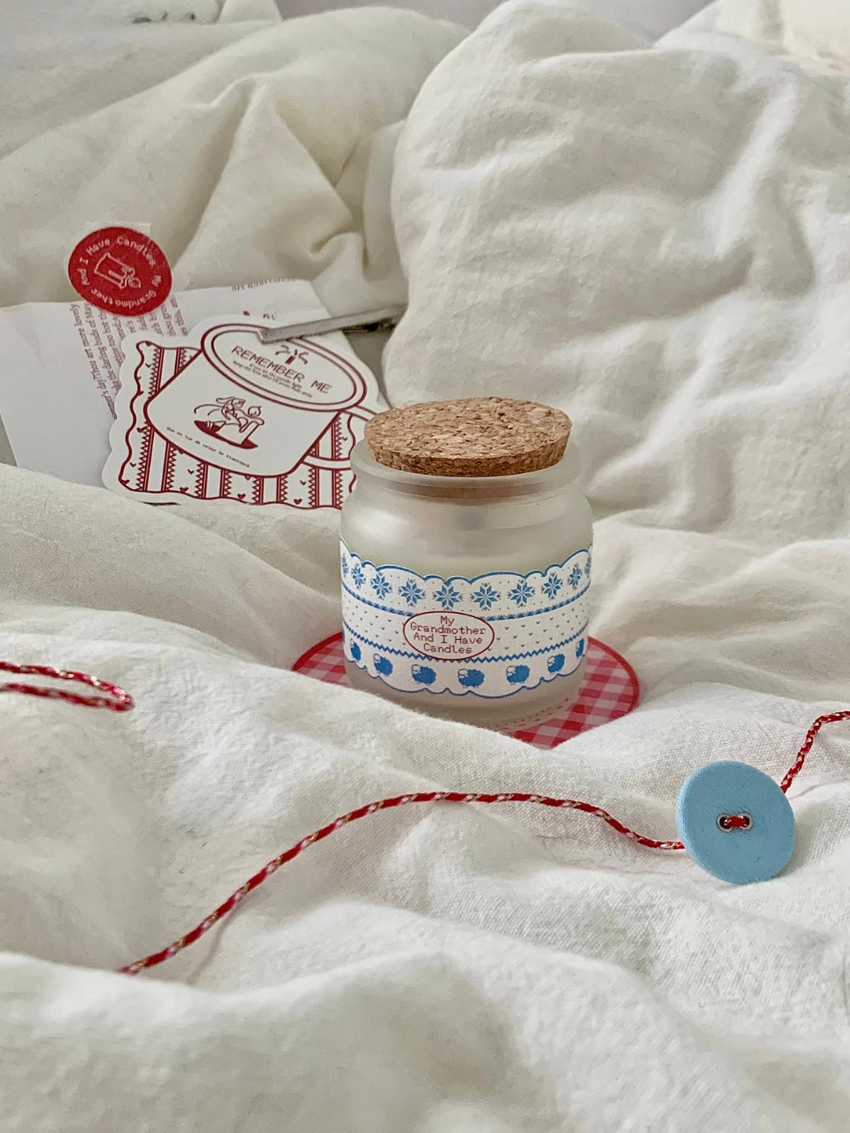 Christmas scented candle gift set styled with card and coaster
