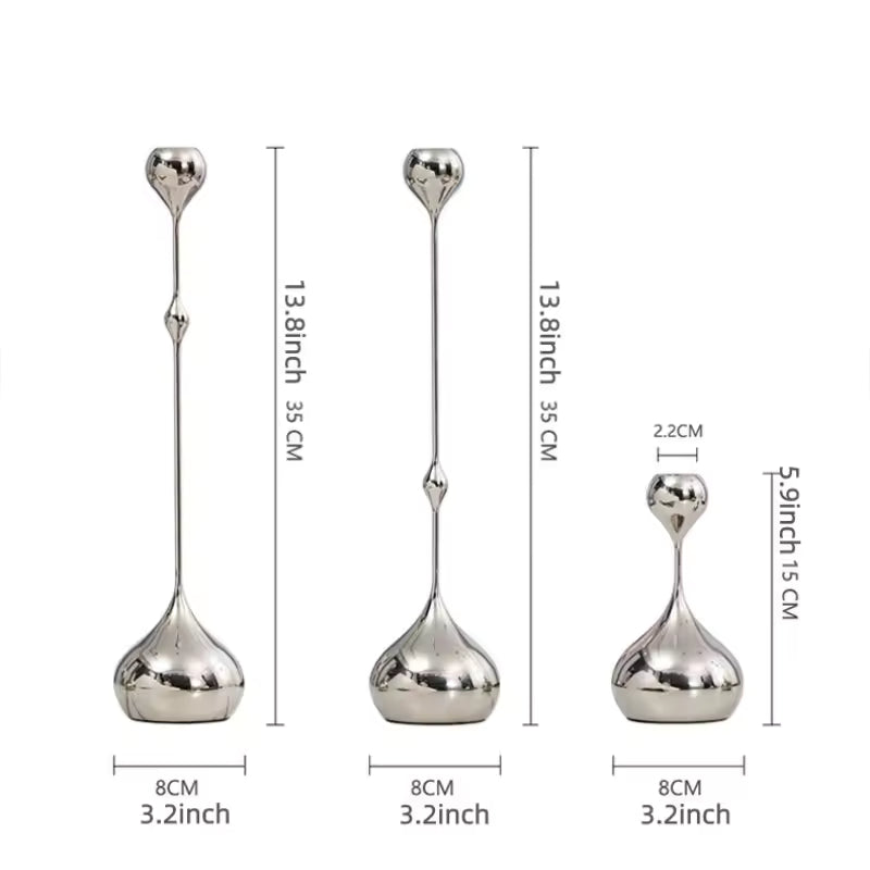 Set of three silver candle holders with measurements on a white background