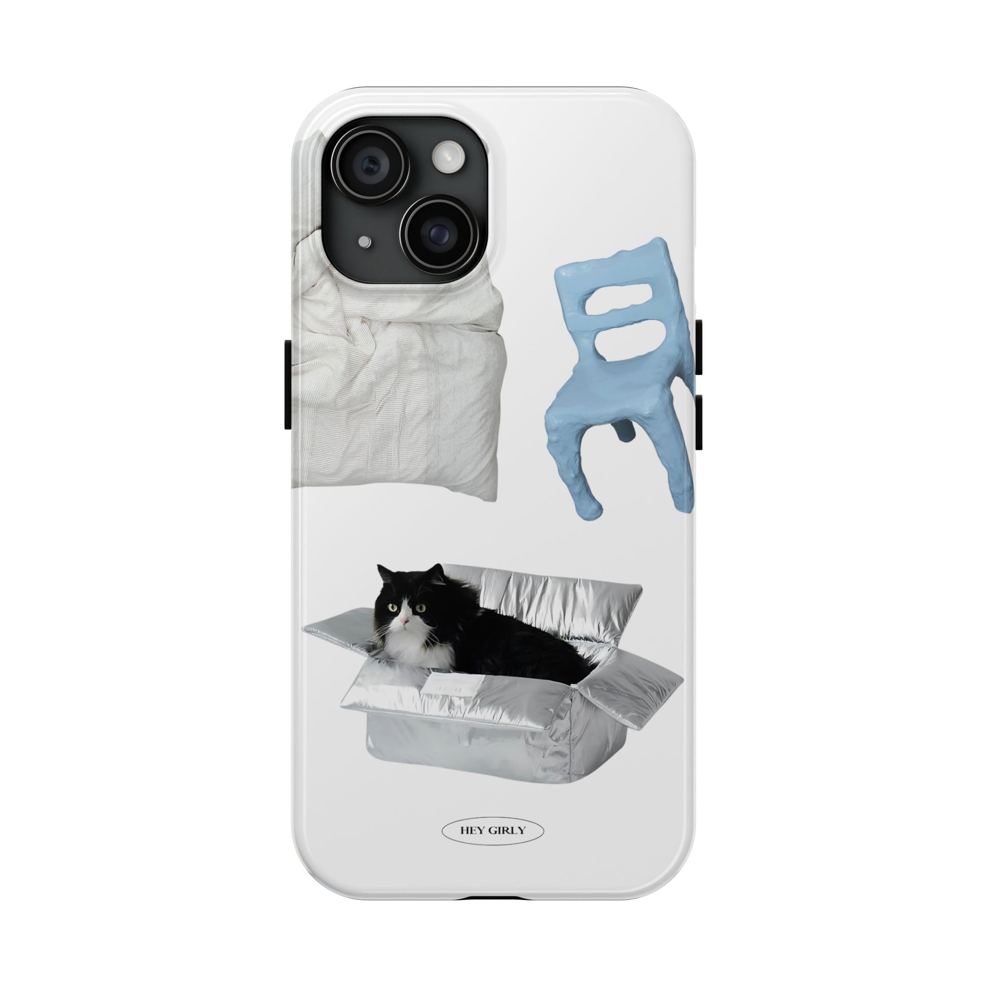 Phone case with a cat peeking out from a hole, surrounded by a chair and blanket, on a white background.