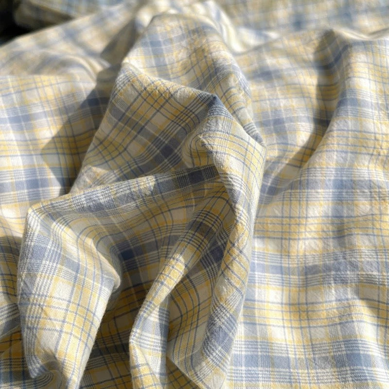 Close-up of yellow and blue plaid fabric
