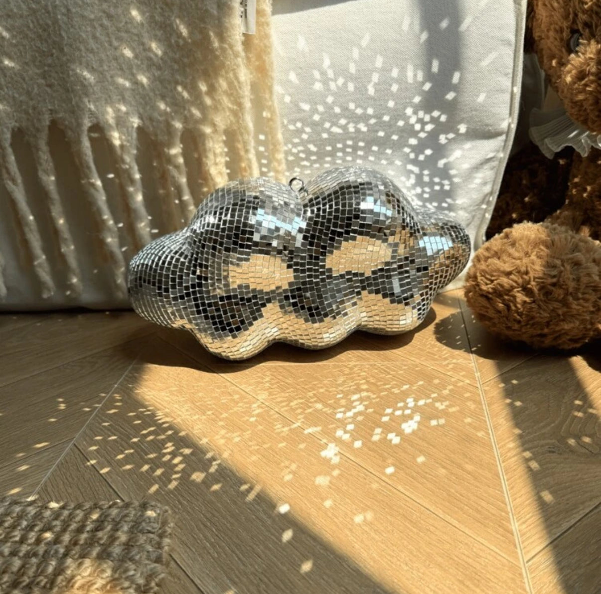 Hanging cloud mirror ball in pink – adds sparkle to soft girl spaces.