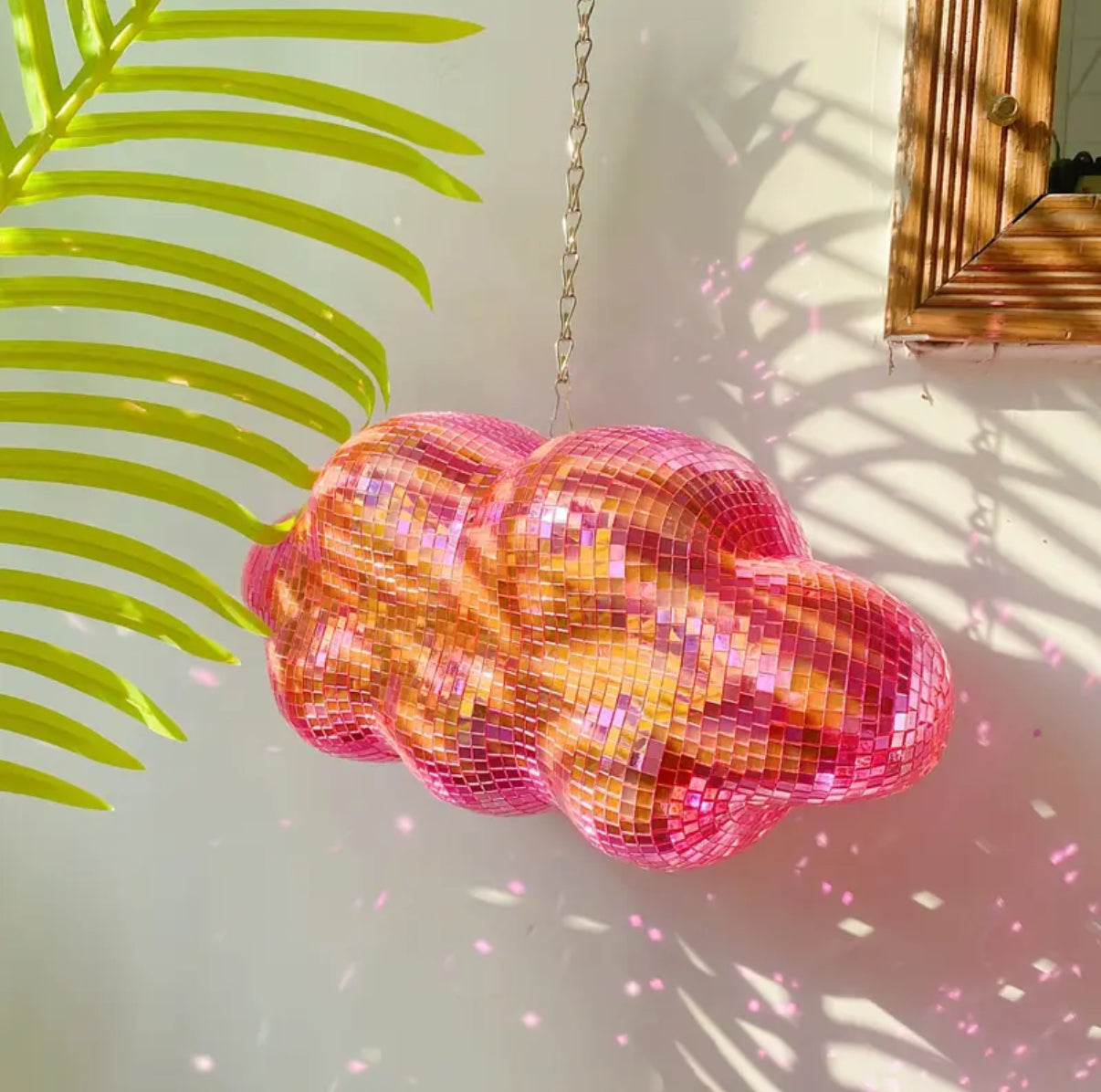 Pink glitter cloud disco with chain – Y2K aesthetic staple.
