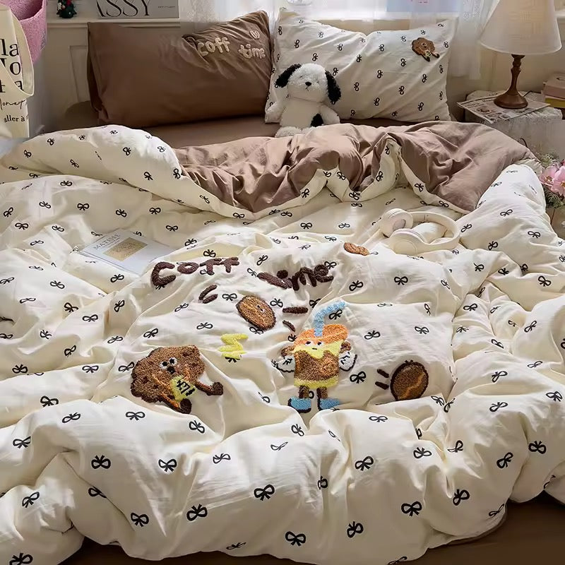 Styled bedroom with coffee bedding, wall art and flowers, showcasing a cozy aesthetic makeover.