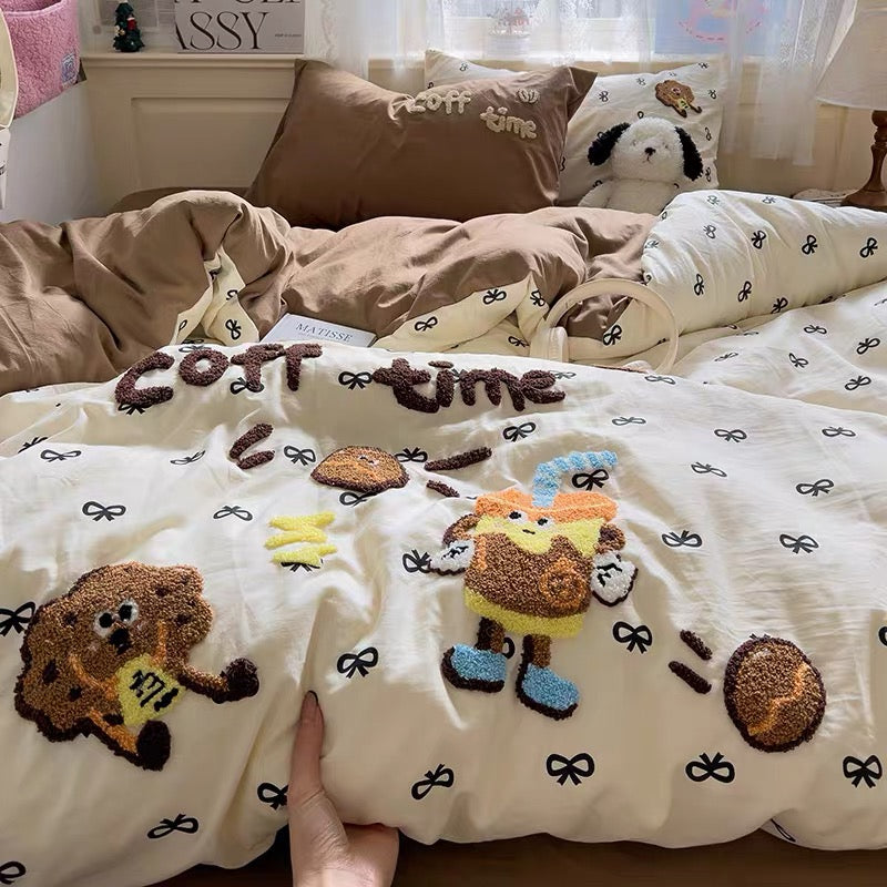 Whimsical coffee cartoon bedding set with cream duvet cover and mocha sheet on a sunlit bed, creating cozy café‑core vibes.