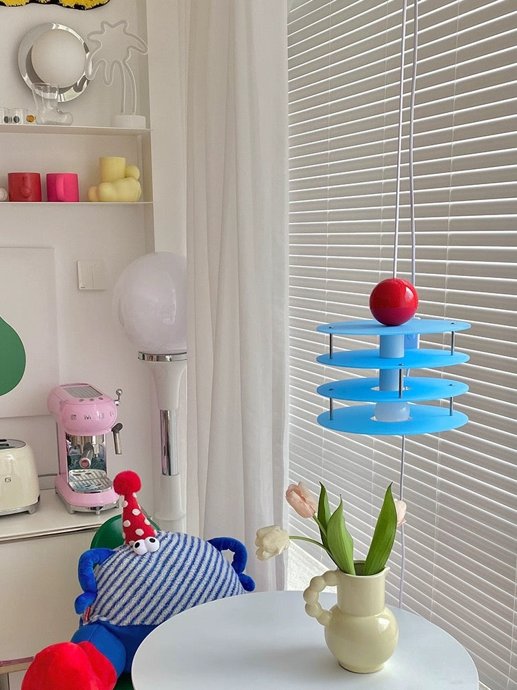 Colorful acrylic chandelier hanging in a kids' room