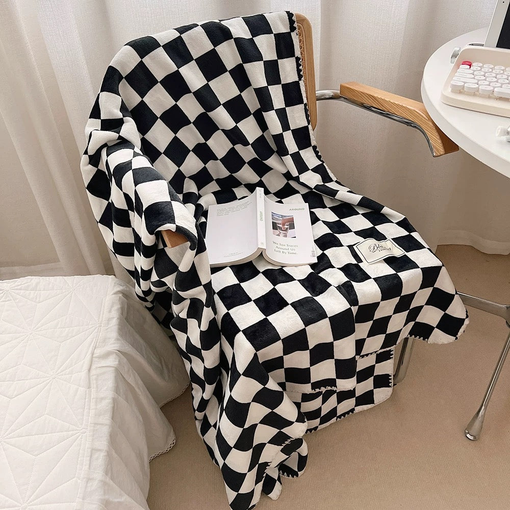 Soft checkered flannel blanket perfect for kids' rooms and nursery decor