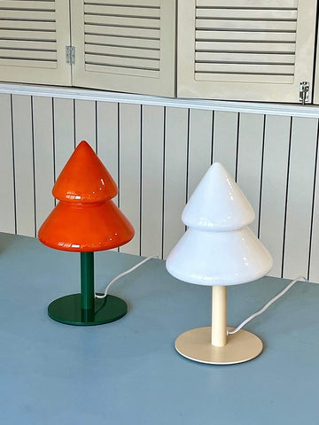 Colorful Christmas tree night lamp in orange and blue styled on a tabletop