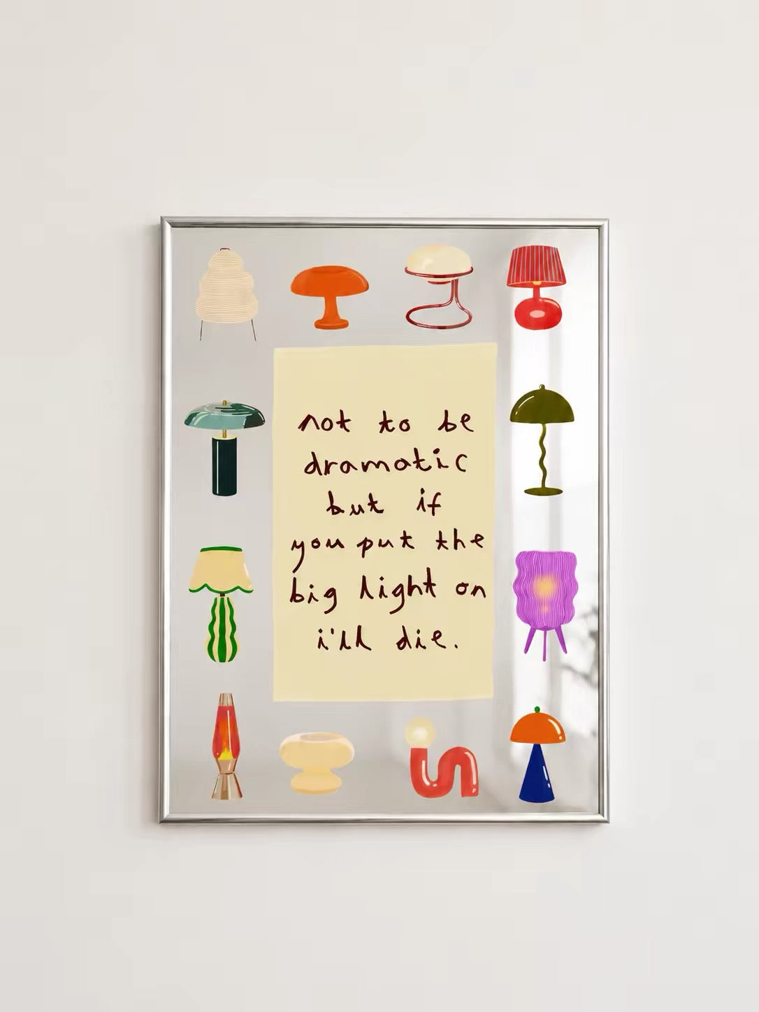 A colorful lamp wall mirror shows a central yellow text panel surrounded by illustrated lamps in a silver frame.