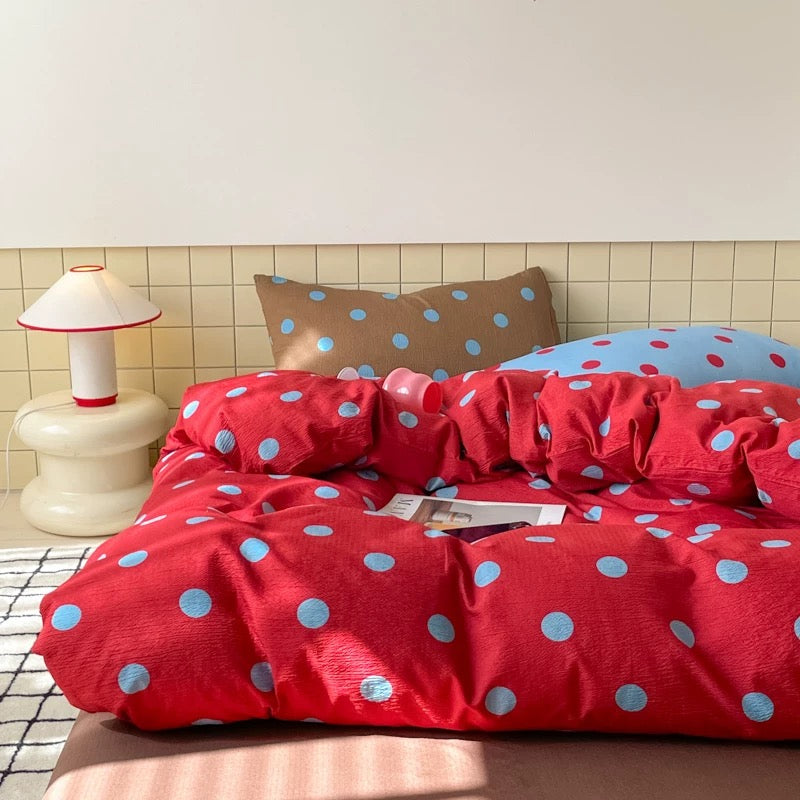 Polka dot bedding set with fitted sheet and pillowcases styled for dorm rooms modern aesthetic