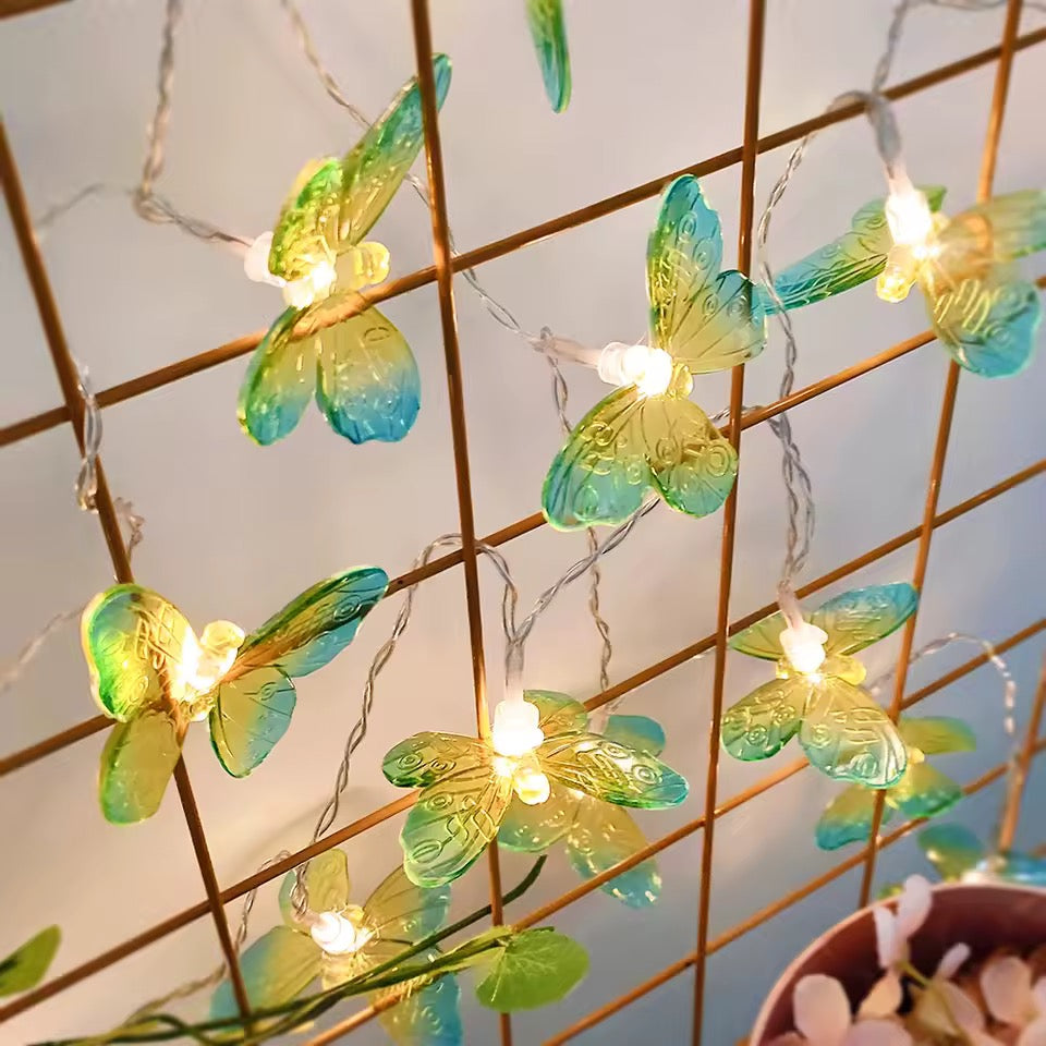 Butterfly-shaped string lights on a grid wall