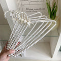 Coquette pearl hanger for clothes display