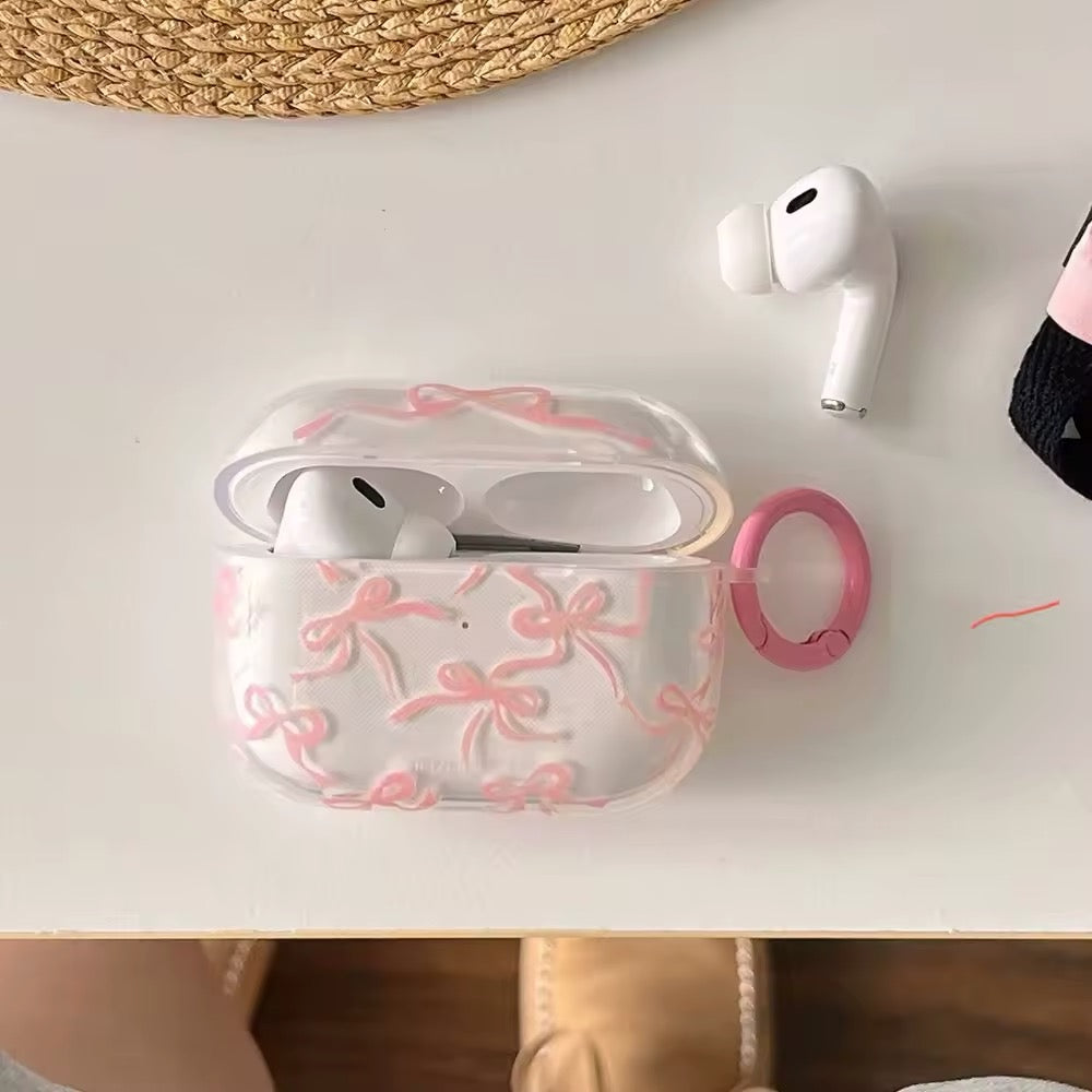 AirPods case with stylish bow knot design and integrated keychain accessory for secure carrying