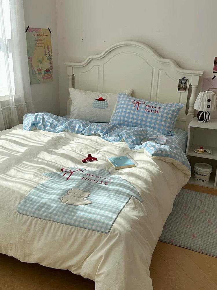 Blue gingham cat bedding set styled in a cozy aesthetic bedroom.