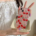 Coquette-style iPhone case with cherries and bowknot design in trendy pink