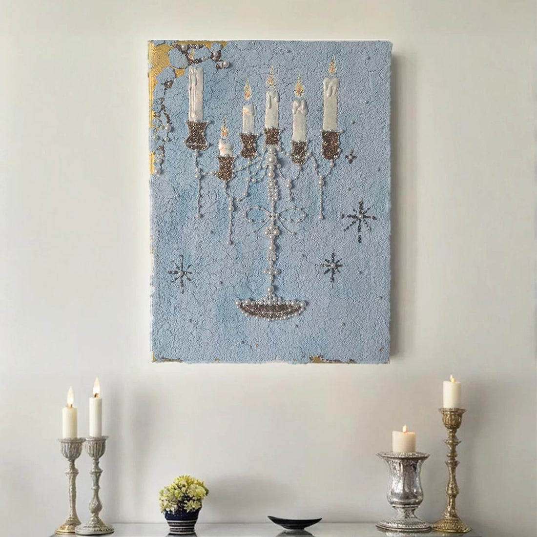 Blue candle canvas wall art with a candelabra and printed pearl details