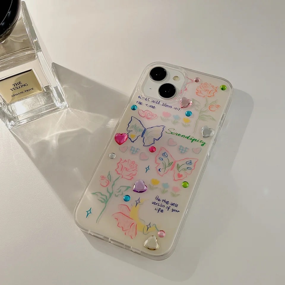 Chic iPhone cover with rhinestones, hearts, and butterfly details