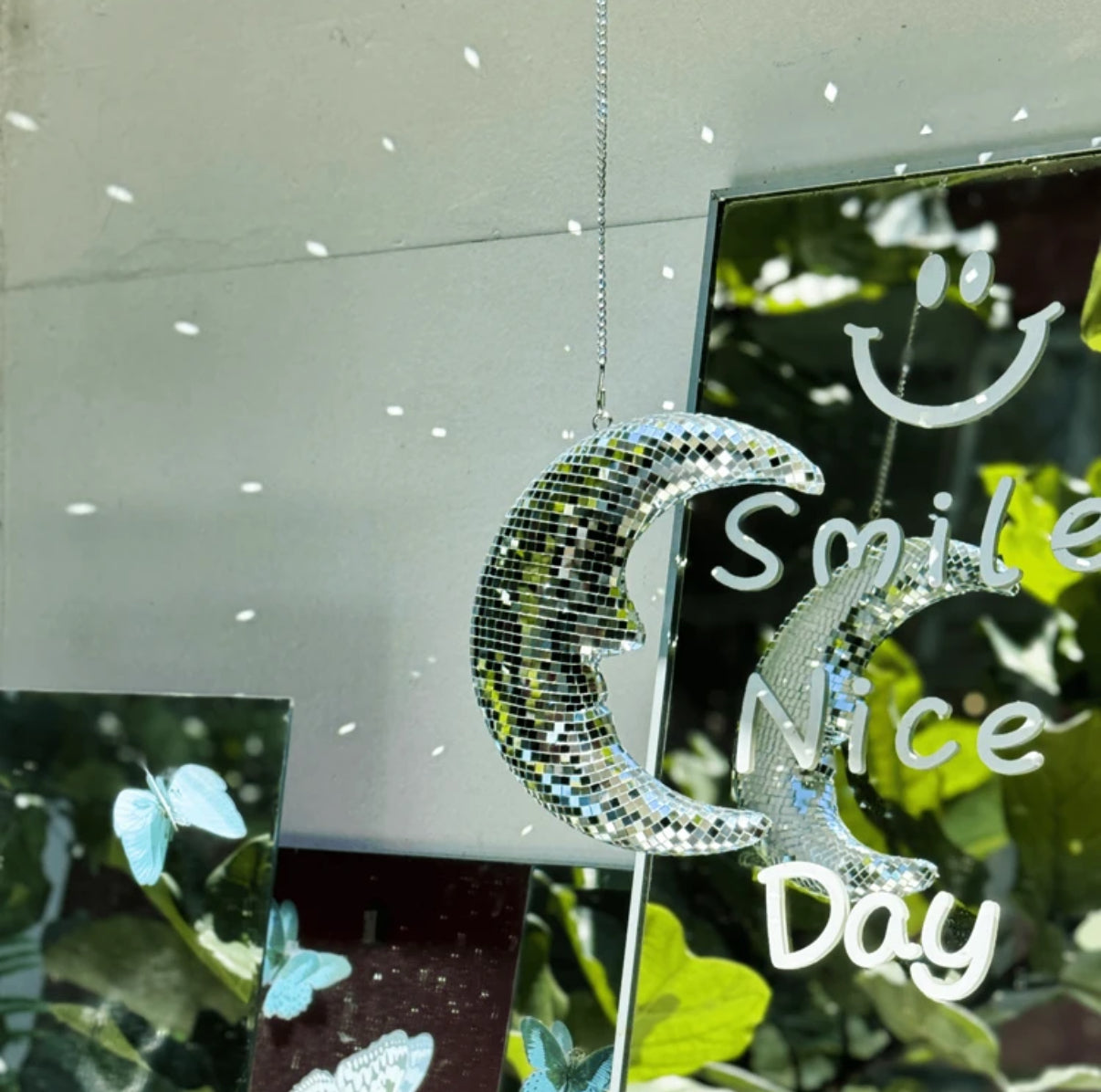 Soft girl aesthetic moon pendant glowing in natural light