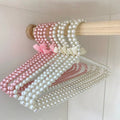 Fashion display hanger with pearls and bow