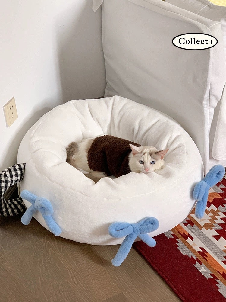 Stylish coquette-inspired pet bed with blue accents