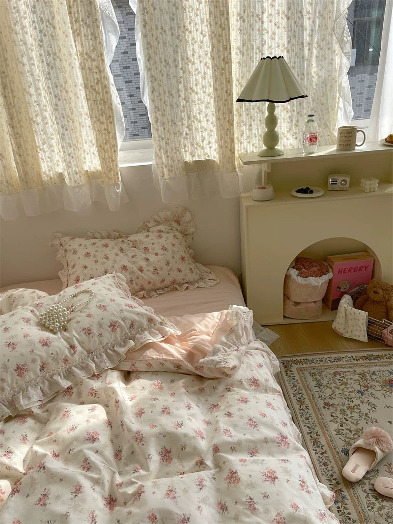 Embroidered lace ruffle bedding draped softly, creating romantic princess vibe