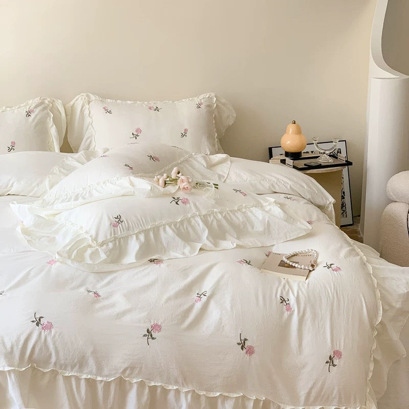 Ruffle duvet cover with delicate pink rose embroidery for a coquette bedroom