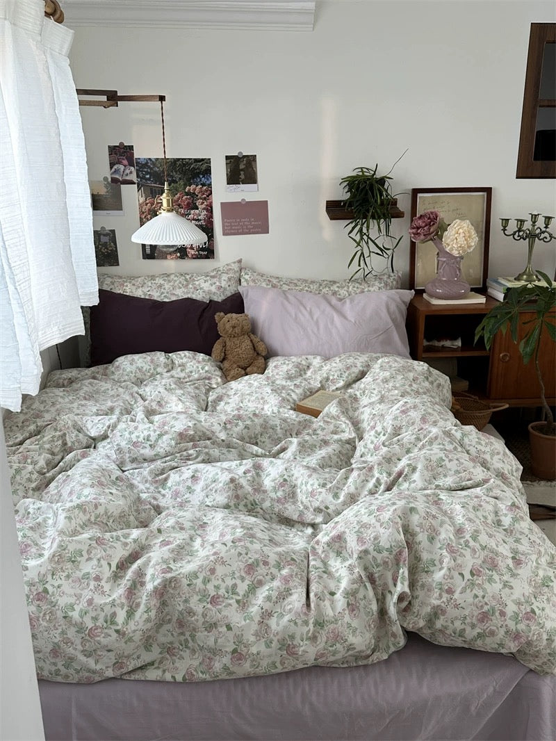 Vintage floral cotton bedding set featuring delicate roses creating cozy cottagecore bedroom with soft romantic atmosphere everyday.