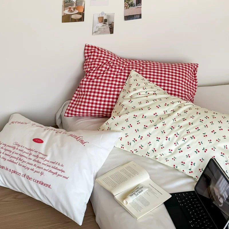 Soft girl aesthetic room with gingham pillow cover and pastel pink accents.