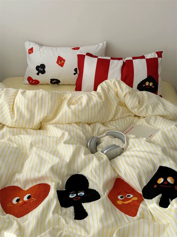 Cute cartoon card bedding with striped background, styled for modern dorm rooms and college girl aesthetic decor.