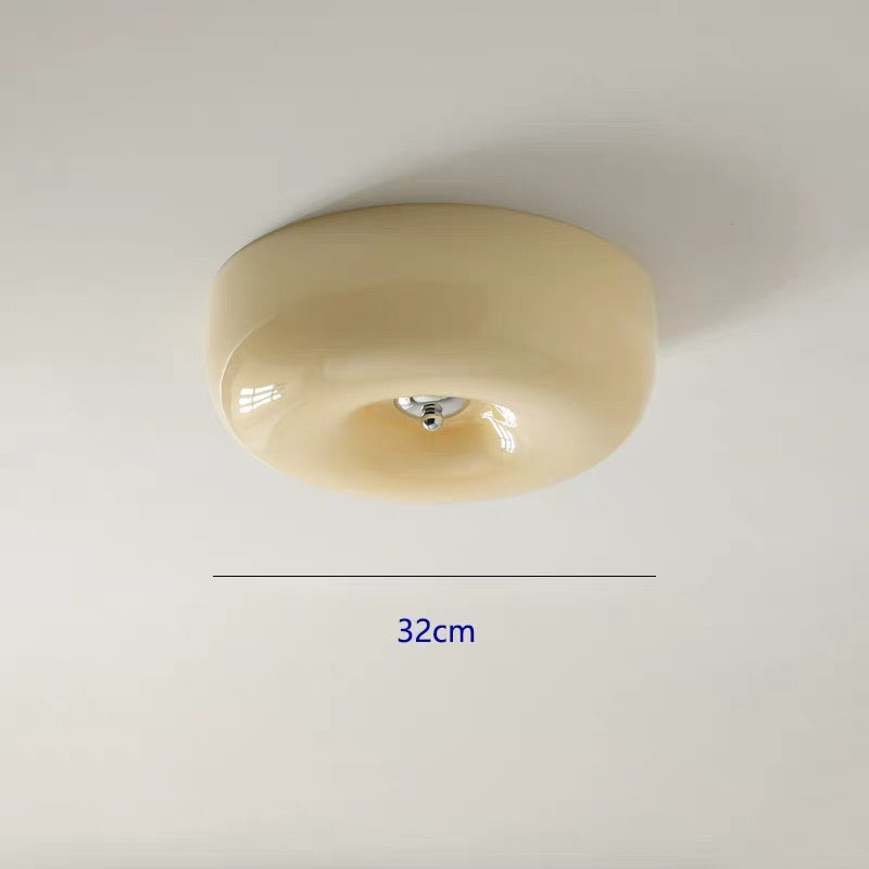 Beige ceiling light fixture on a white background with measurement label